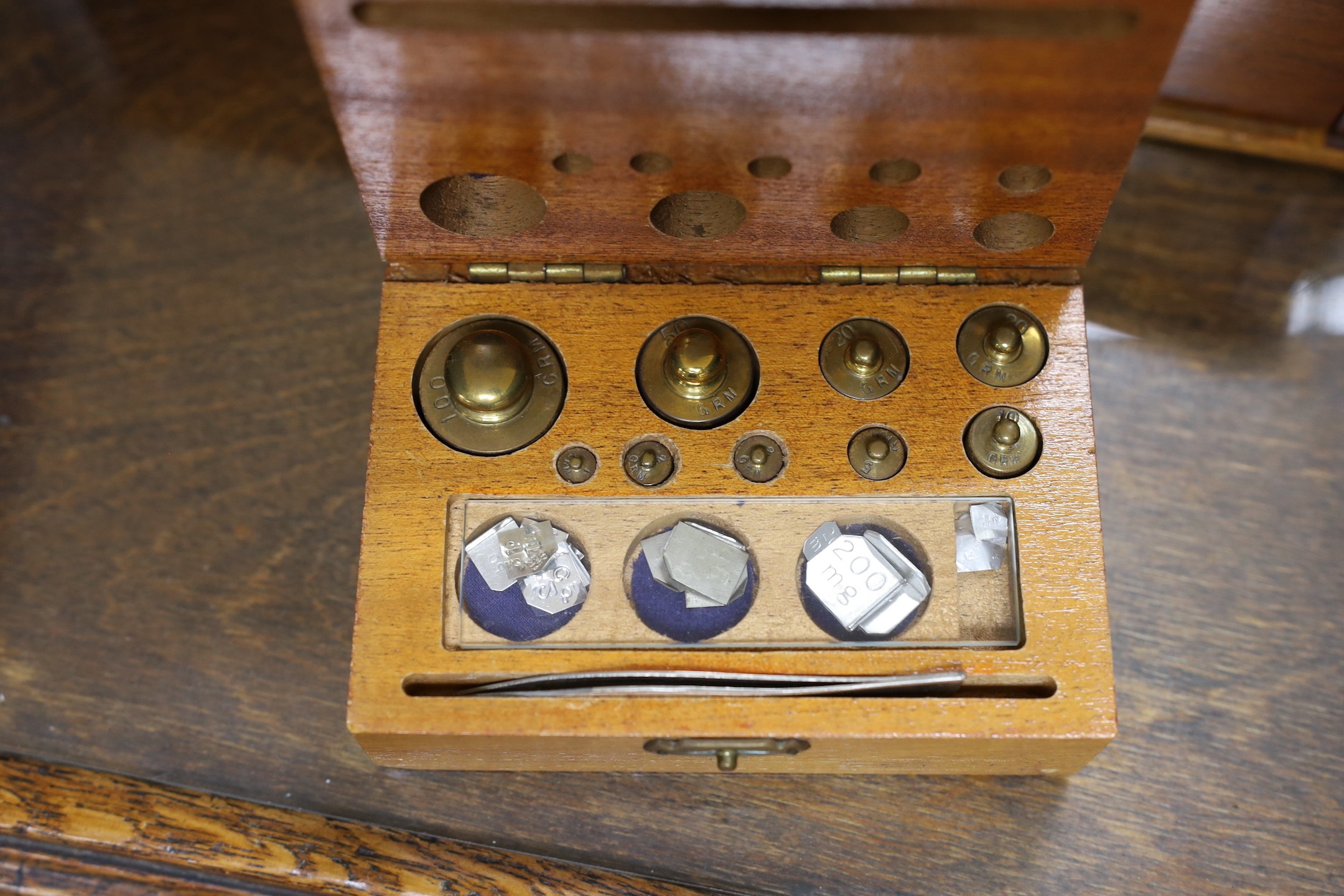 A Victorian oak instrument stand and a set of Stanley scales with weights